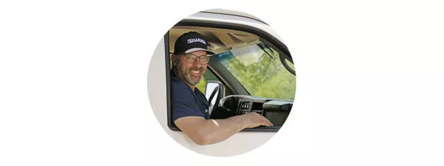 Garage door technician in his service vehicle